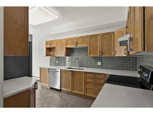 221-223 Tuscany Springs Boulevard Nw, Calgary, AB - Indoor Photo Showing Kitchen With Stainless Steel Kitchen