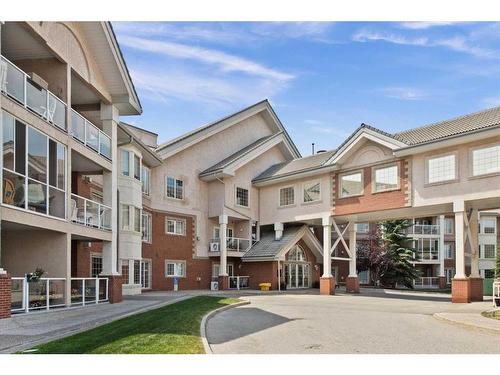 221-223 Tuscany Springs Boulevard Nw, Calgary, AB - Outdoor With Balcony With Facade