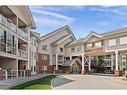 221-223 Tuscany Springs Boulevard Nw, Calgary, AB  - Outdoor With Balcony With Facade 