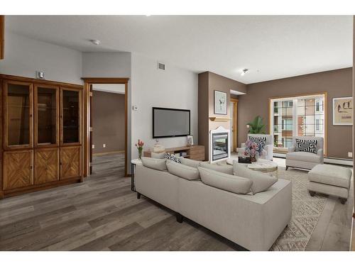 221-223 Tuscany Springs Boulevard Nw, Calgary, AB - Indoor Photo Showing Living Room With Fireplace