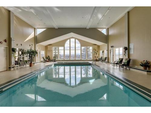 221-223 Tuscany Springs Boulevard Nw, Calgary, AB - Indoor Photo Showing Other Room With In Ground Pool