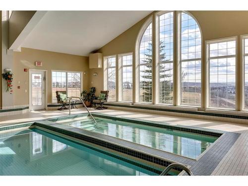 221-223 Tuscany Springs Boulevard Nw, Calgary, AB - Indoor Photo Showing Other Room With In Ground Pool