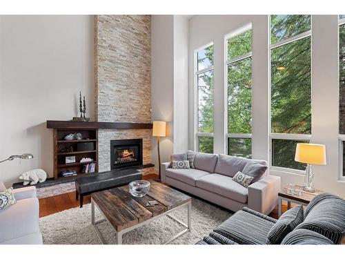 4-136 Silvertip Ridge, Canmore, AB - Indoor Photo Showing Living Room With Fireplace