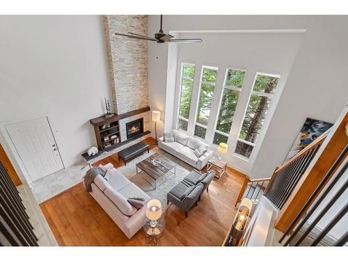 4-136 Silvertip Ridge, Canmore, AB - Indoor Photo Showing Living Room With Fireplace