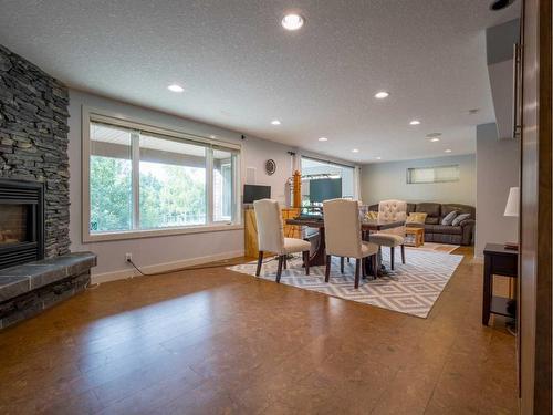 77 Royal Highland Road Nw, Calgary, AB - Indoor Photo Showing Other Room With Fireplace