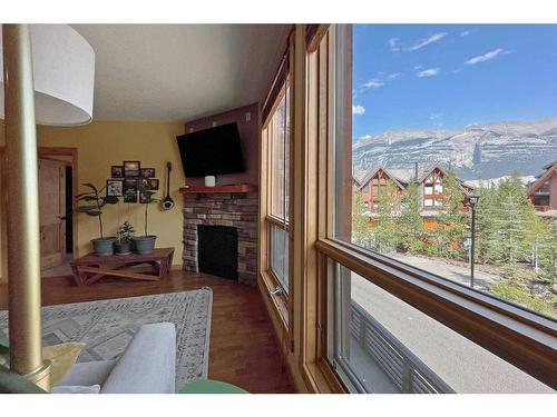 201-2100B Stewart Creek Drive, Canmore, AB - Indoor With Fireplace