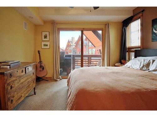 201-2100B Stewart Creek Drive, Canmore, AB - Indoor Photo Showing Bedroom