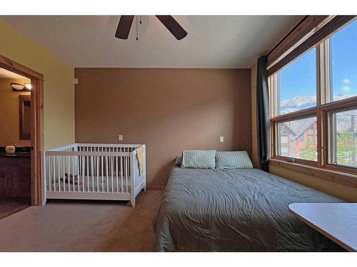 201-2100B Stewart Creek Drive, Canmore, AB - Indoor Photo Showing Bedroom