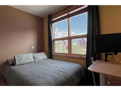 201-2100B Stewart Creek Drive, Canmore, AB - Indoor Photo Showing Bedroom