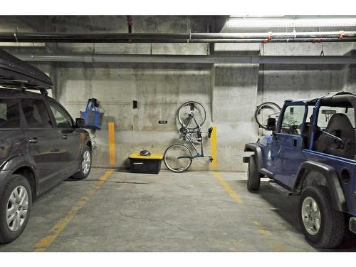 201-2100B Stewart Creek Drive, Canmore, AB - Indoor Photo Showing Garage