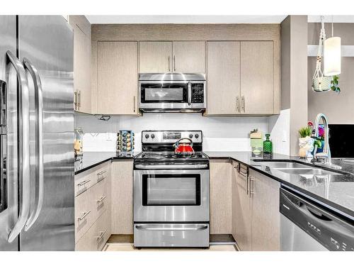 3309-240 Skyview Ranch Road Ne, Calgary, AB - Indoor Photo Showing Kitchen With Stainless Steel Kitchen With Double Sink With Upgraded Kitchen