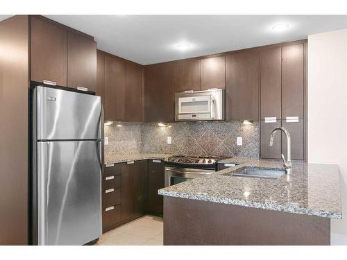 2207-99 Spruce Place Sw, Calgary, AB - Indoor Photo Showing Kitchen With Stainless Steel Kitchen With Upgraded Kitchen