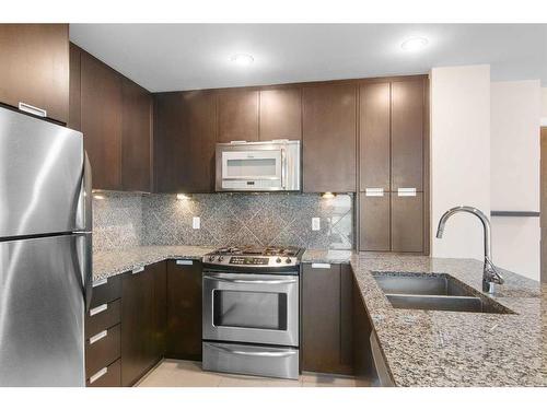 2207-99 Spruce Place Sw, Calgary, AB - Indoor Photo Showing Kitchen With Stainless Steel Kitchen With Double Sink With Upgraded Kitchen