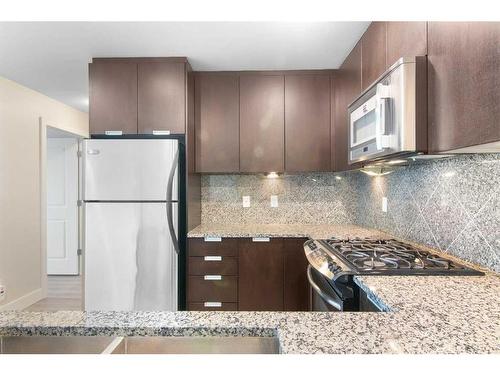 2207-99 Spruce Place Sw, Calgary, AB - Indoor Photo Showing Kitchen With Upgraded Kitchen