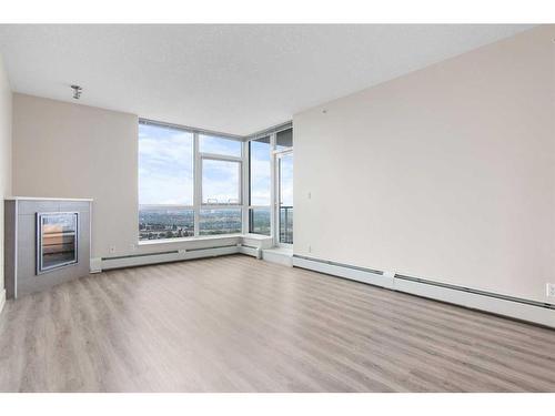 2207-99 Spruce Place Sw, Calgary, AB - Indoor With Fireplace