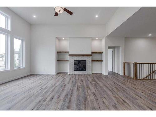 6 Harrison Green, Olds, AB - Indoor Photo Showing Other Room With Fireplace