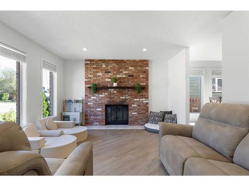 70 Dobler Avenue, Red Deer, AB - Indoor Photo Showing Living Room With Fireplace