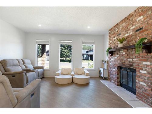 70 Dobler Avenue, Red Deer, AB - Indoor Photo Showing Living Room With Fireplace