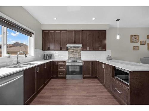 679 Cornerstone Way Ne, Calgary, AB - Indoor Photo Showing Kitchen With Double Sink