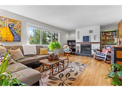 1309 Mcalpine Street, Carstairs, AB - Indoor Photo Showing Living Room With Fireplace