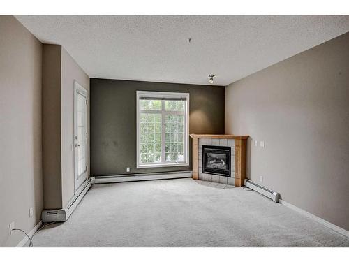 334-5201 Dalhousie Drive Nw, Calgary, AB - Indoor With Fireplace