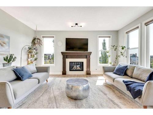 152 Drake Landing Terrace, Okotoks, AB - Indoor Photo Showing Living Room With Fireplace