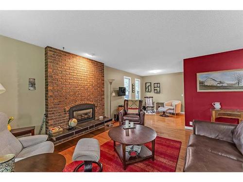 10232 Brookpark Boulevard Sw, Calgary, AB - Indoor Photo Showing Living Room With Fireplace