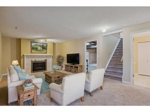 181 Macewan Ridge Villas, Calgary, AB - Indoor Photo Showing Living Room With Fireplace