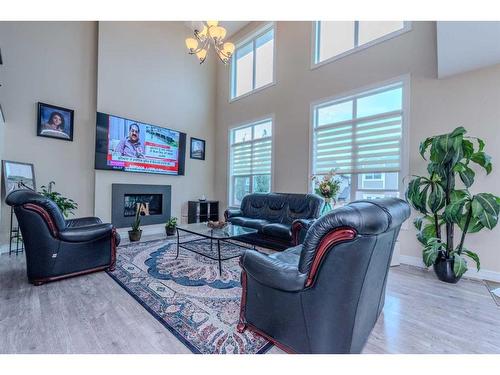 152 Aspenmere Way, Chestermere, AB - Indoor Photo Showing Living Room With Fireplace