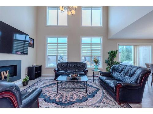 152 Aspenmere Way, Chestermere, AB - Indoor Photo Showing Living Room With Fireplace