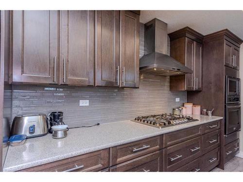 152 Aspenmere Way, Chestermere, AB - Indoor Photo Showing Kitchen With Upgraded Kitchen