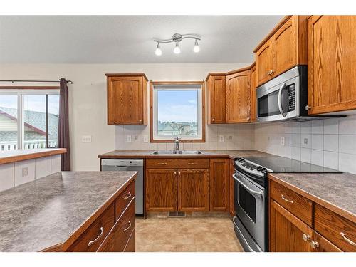 534 Country Meadows Way Nw, Diamond Valley, AB - Indoor Photo Showing Kitchen With Double Sink