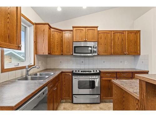 534 Country Meadows Way Nw, Diamond Valley, AB - Indoor Photo Showing Kitchen With Double Sink