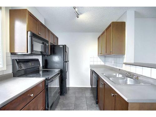 3225-16320 24 Street Sw, Calgary, AB - Indoor Photo Showing Kitchen With Double Sink