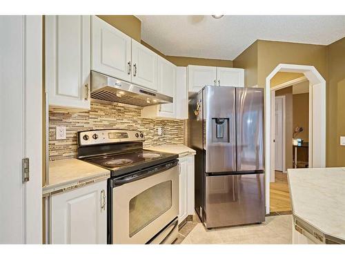 115 Douglas Glen Close Se, Calgary, AB - Indoor Photo Showing Kitchen With Stainless Steel Kitchen