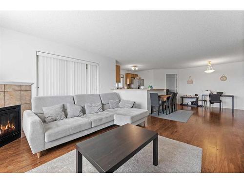 1426-60 Panatella Street Nw, Calgary, AB - Indoor Photo Showing Living Room With Fireplace