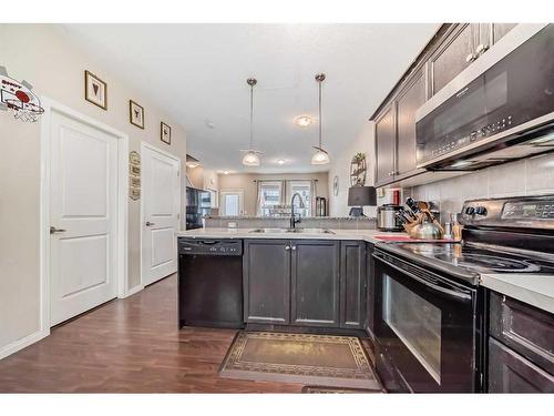 1104-1001 8 Street Nw, Airdrie, AB - Indoor Photo Showing Kitchen With Double Sink With Upgraded Kitchen