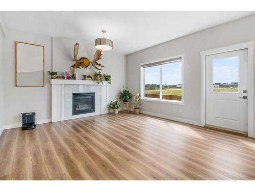 1328 Lackner Boulevard, Carstairs, AB - Indoor Photo Showing Living Room With Fireplace