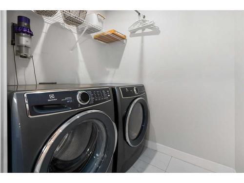 1328 Lackner Boulevard, Carstairs, AB - Indoor Photo Showing Laundry Room