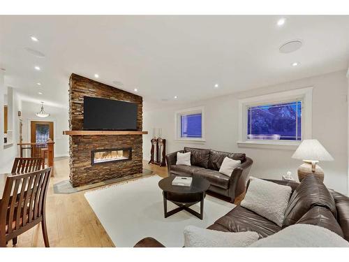 831 Millar Road Ne, Calgary, AB - Indoor Photo Showing Living Room With Fireplace