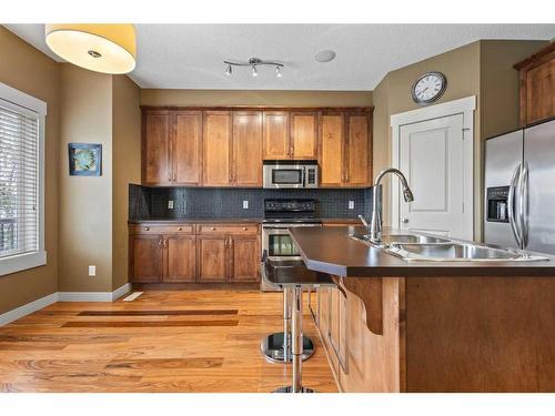 257 Rainbow Falls Drive, Chestermere, AB - Indoor Photo Showing Kitchen With Double Sink