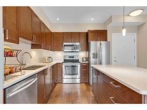 311-22 Auburn Bay Link Se, Calgary, AB - Indoor Photo Showing Kitchen With Stainless Steel Kitchen With Double Sink