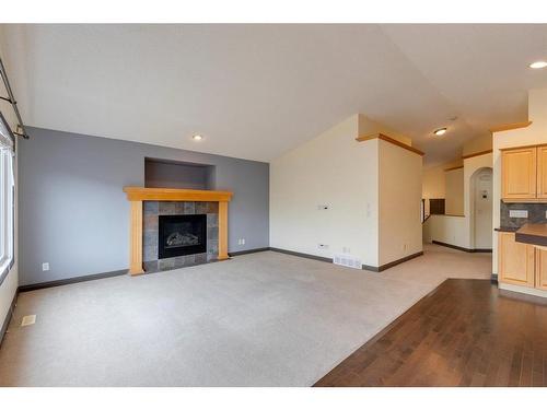 32 Covehaven Terrace Ne, Calgary, AB - Indoor Photo Showing Living Room With Fireplace