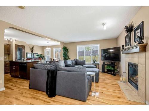 262 Evanscreek Court Nw, Calgary, AB - Indoor Photo Showing Living Room With Fireplace