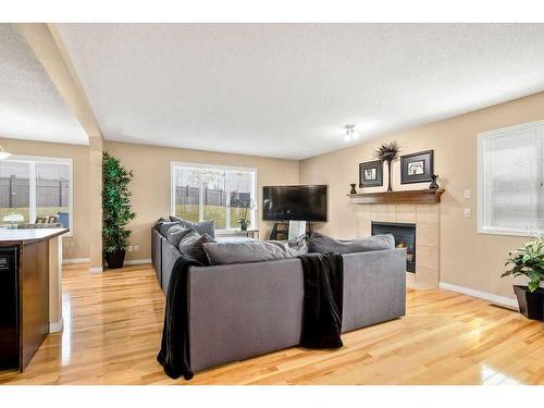 262 Evanscreek Court Nw, Calgary, AB - Indoor Photo Showing Living Room With Fireplace