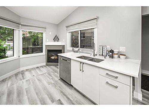 322 22 Avenue Sw, Calgary, AB - Indoor Photo Showing Kitchen With Fireplace With Double Sink