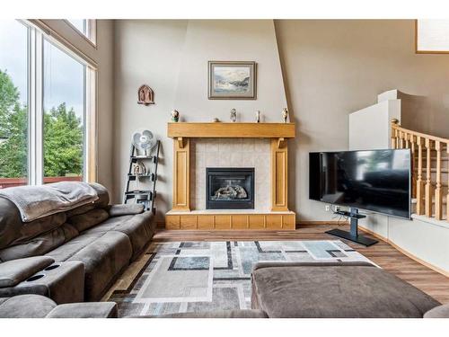 1240 Everridge Drive Sw, Calgary, AB - Indoor Photo Showing Living Room With Fireplace