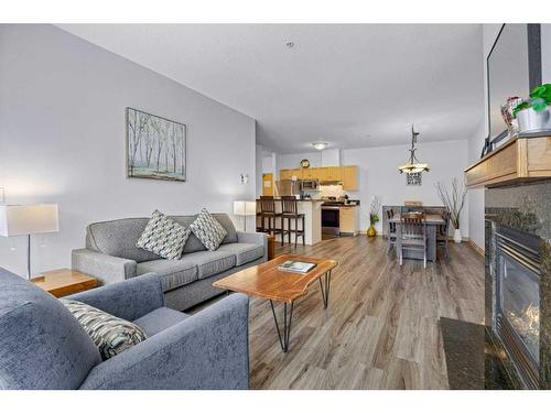 316-1151 Sidney Street, Canmore, AB - Indoor Photo Showing Living Room With Fireplace