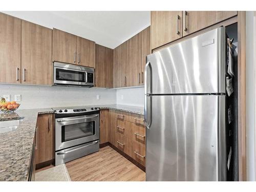 2-12 Sage Hill Terrace Nw, Calgary, AB - Indoor Photo Showing Kitchen With Double Sink With Upgraded Kitchen