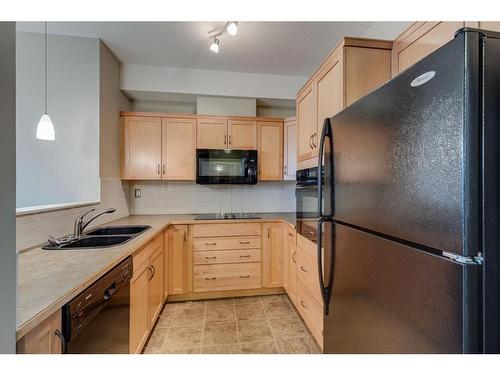 525-26 Val Gardena View Sw, Calgary, AB - Indoor Photo Showing Kitchen With Double Sink